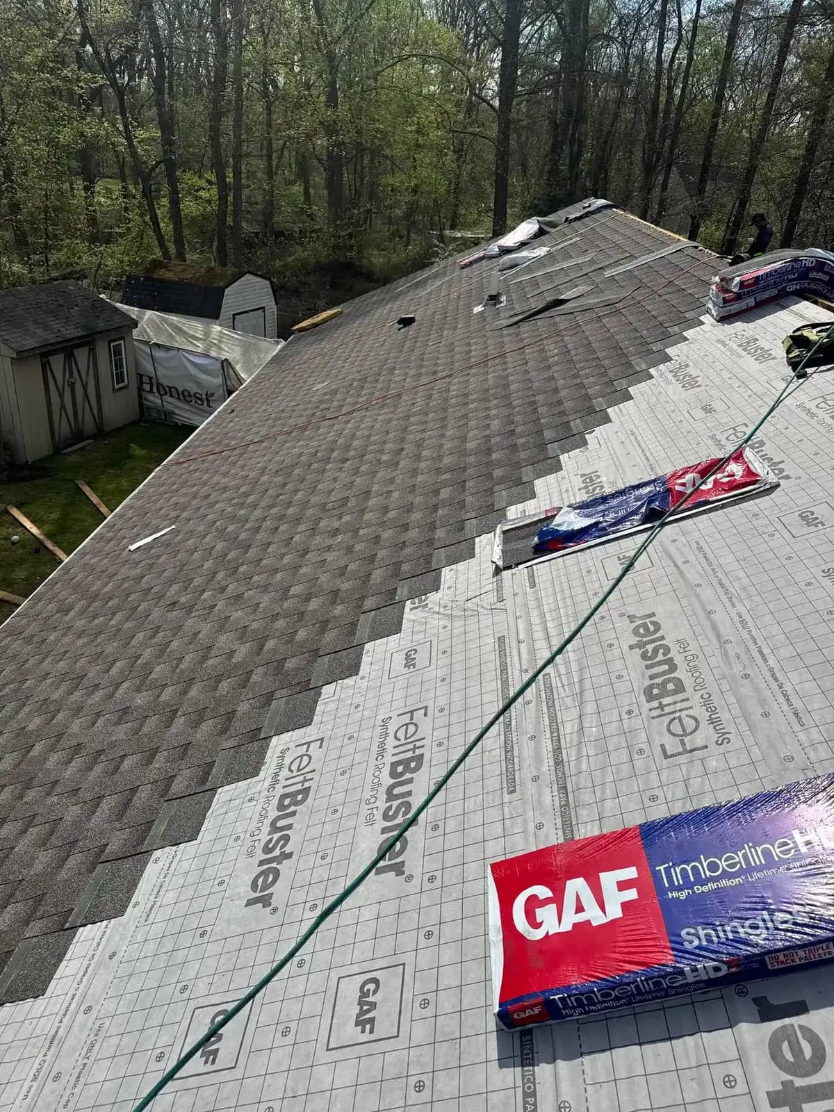 Shingle installation during a Cherry Hill roof replacement