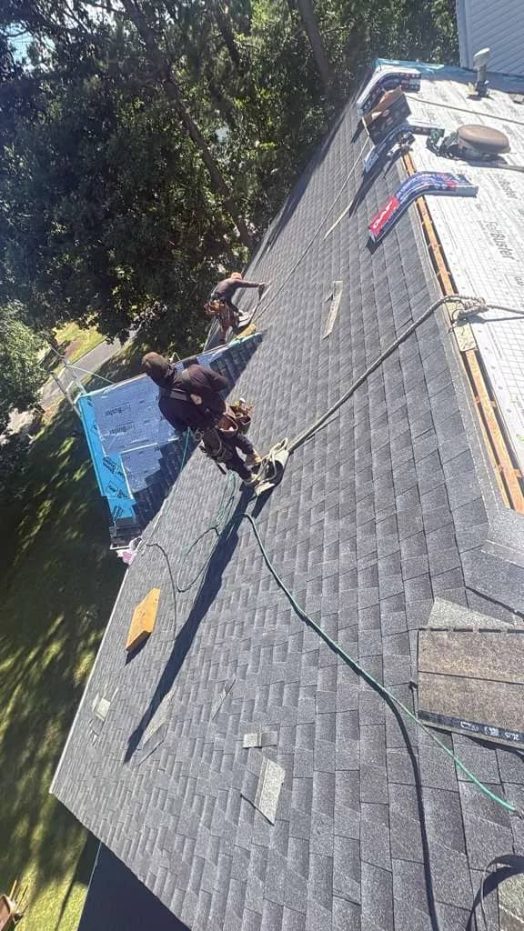 Roofers installing shingles in Jackson Township, New Jersey