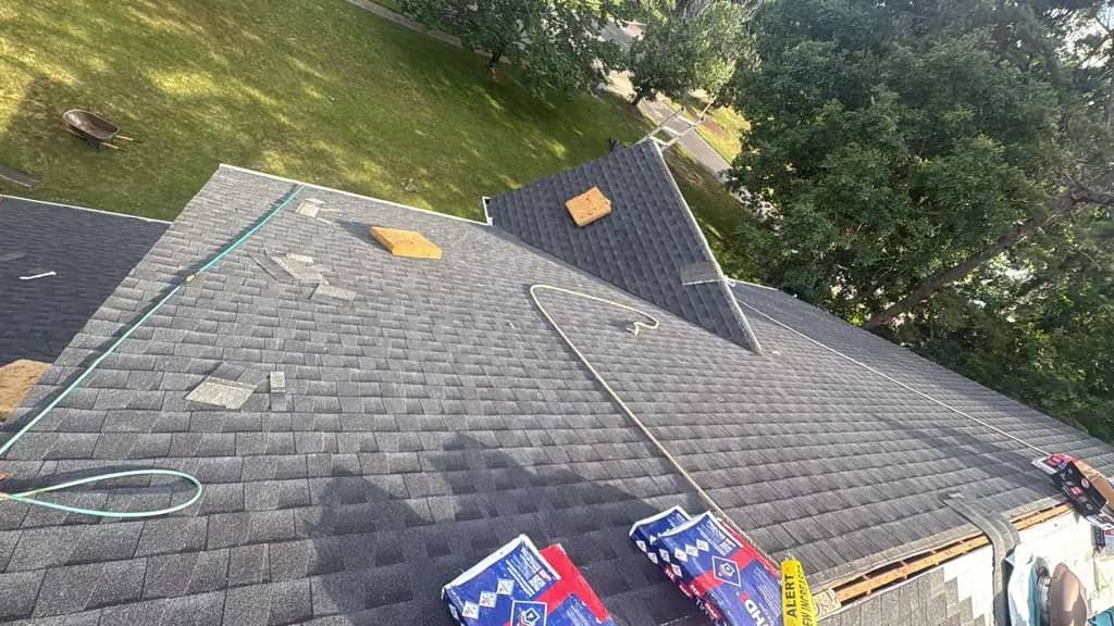 Shingle installation across a Jackson Township roof