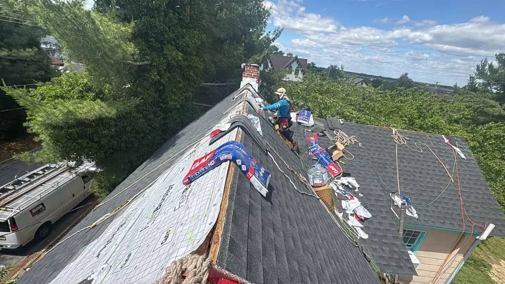 Shingle installation during a Millville roof replacement