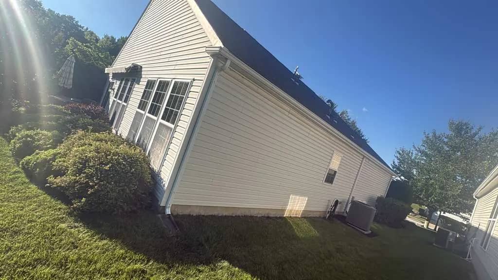 Ground-level view of a Newark, Delaware home and roofline