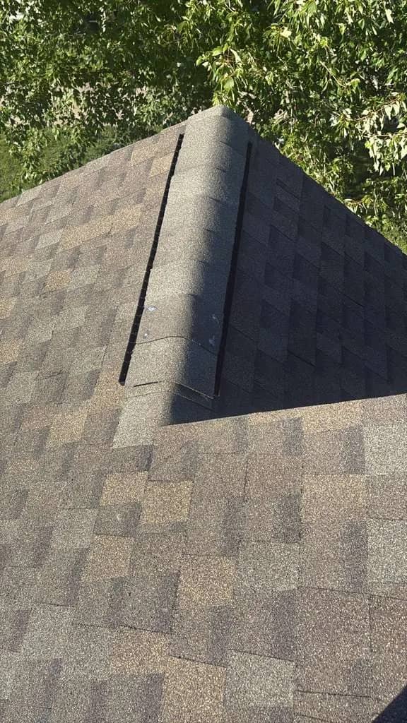 Intersecting shingle roof planes in Newark, Delaware