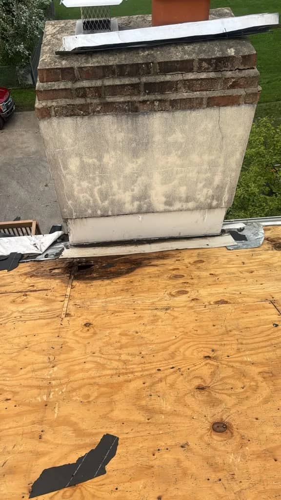 Plywood roof deck beside the chimney during the Norristown project