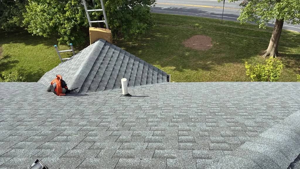 New charcoal shingle roof planes on the Norristown home
