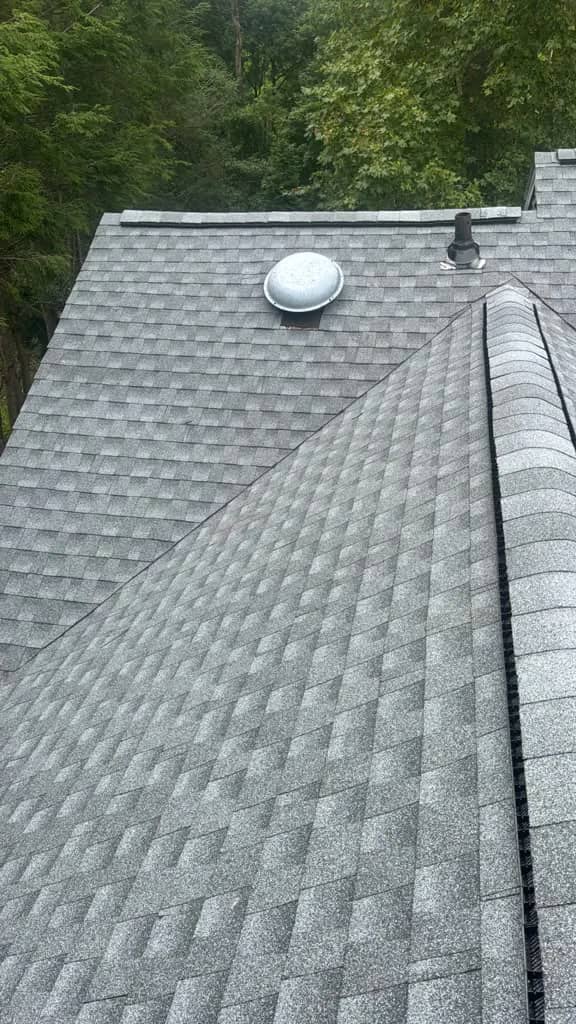 Completed intersecting shingle roof planes with a roof vent in Penn Wynne