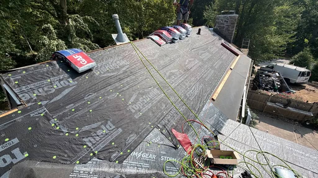 Underlayment across connected roof planes during a Penn Wynne roof replacement