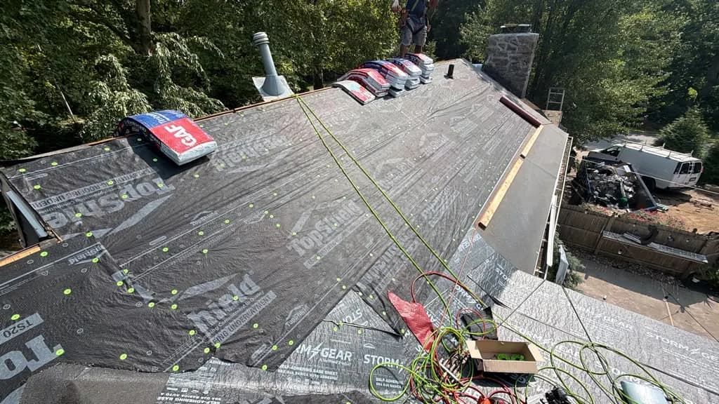 Underlayment across connected roof planes during a Penn Wynne roof replacement
