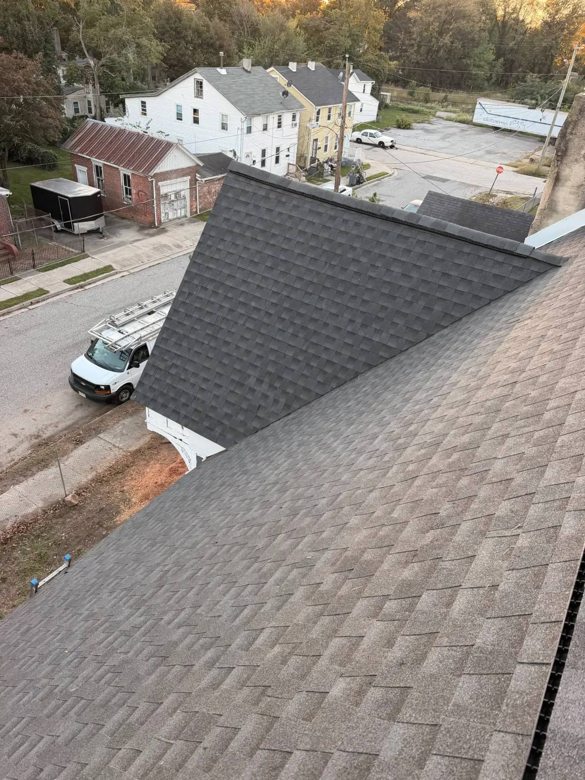 New Charcoal shingles on the main and intersecting Salem roof slopes