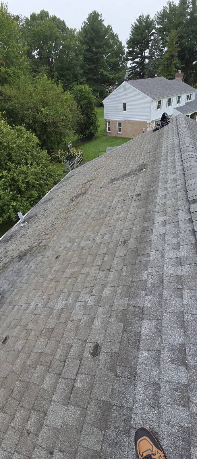 Existing shingles and ridge before the Southampton roof replacement