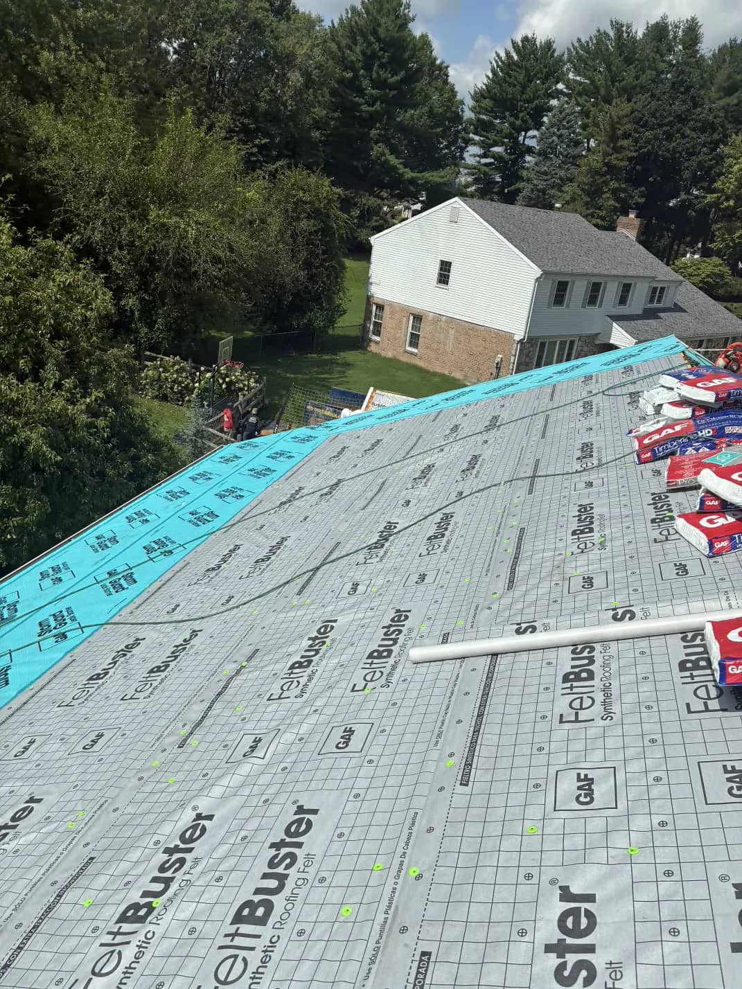 Underlayment covering a roof slope before shingle installation in Southampton